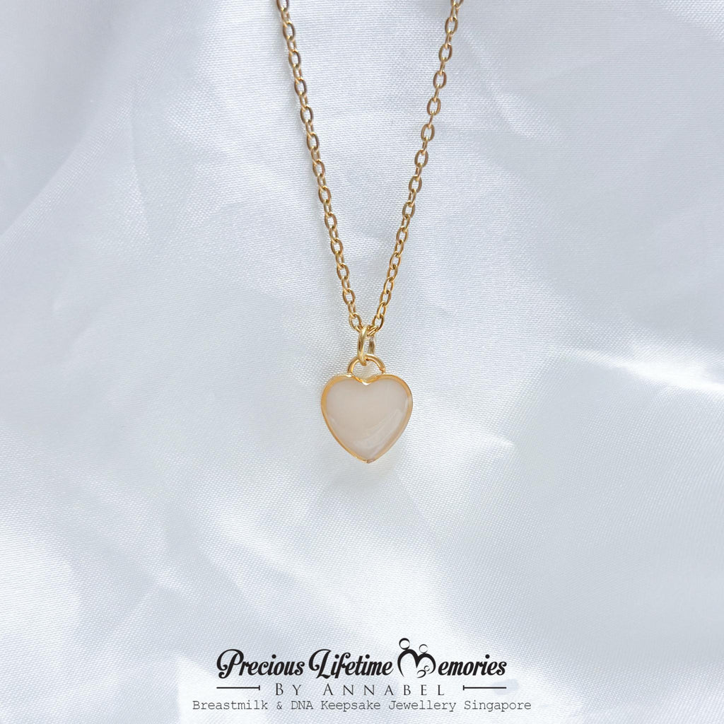 Heart-shaped pendant necklace on a white background with 'Precious Lifetime Memories by Annabel' branding.