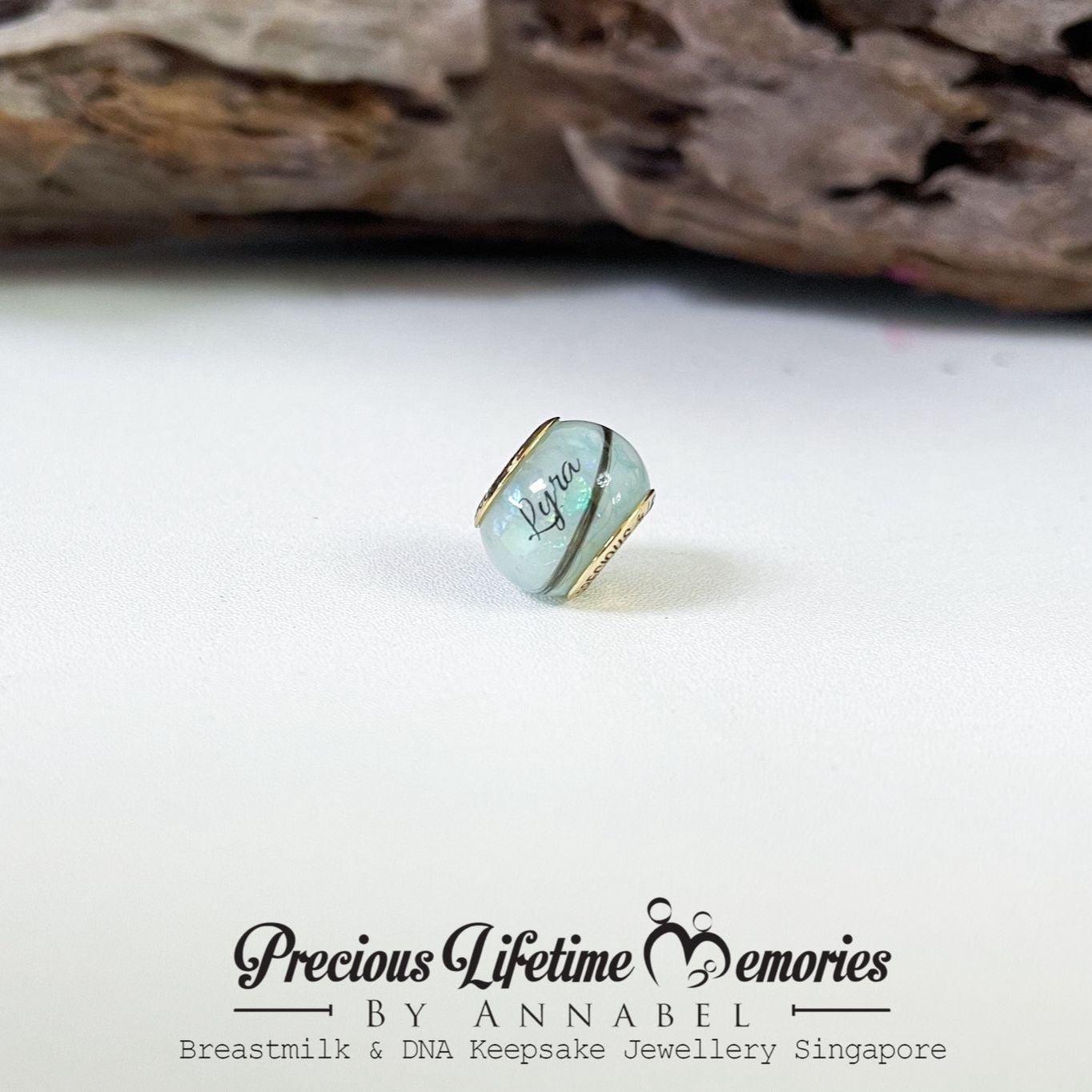 Jewelry piece with 'Precious Lifetime Memories by Annabel' branding on a white background.