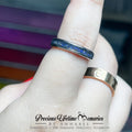 Two rings on a finger with a blurred background and 'Precious Lifetime Memories by Annabel' branding.