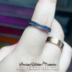 Two rings on a finger with a blurred background and 'Precious Lifetime Memories by Annabel' branding.