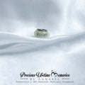 Silver charm on white fabric with 'Precious Lifetime Memories by Annabel' branding.
