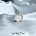 Crystal pendant on a satin fabric with 'Precious Lifetime Memories by Annabel' branding.
