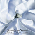 Silver tiara with heart design on a white fabric background, featuring 'Precious Lifetime Memories by Annabel' branding.