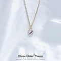 Necklace with a round pendant on a white background, featuring the brand 'Precious Lifetime Memories by Annabel'.