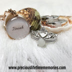 Jewelry set with a shell and engraved pendant on a white background