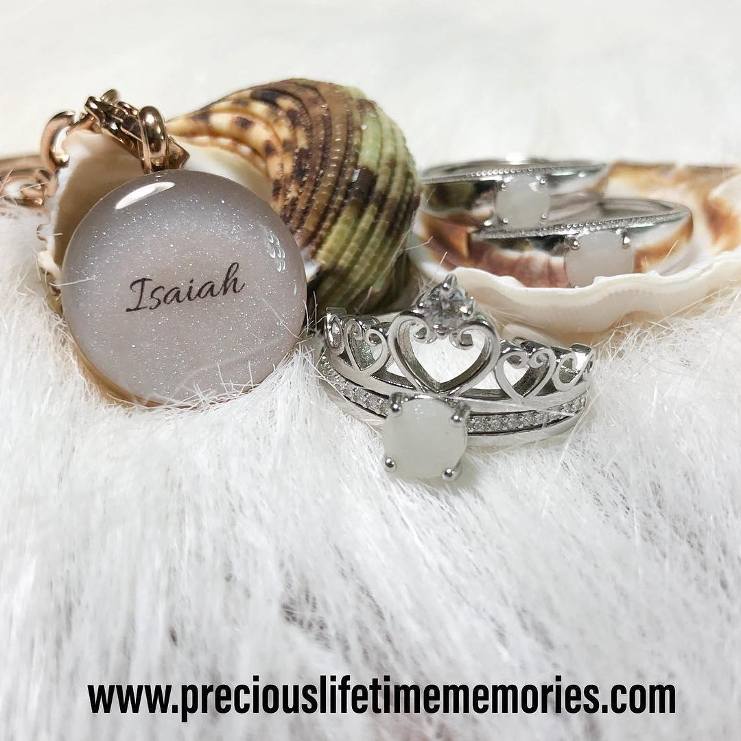 Jewelry set with a shell and engraved pendant on a white background