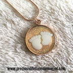 Necklace with a round pendant featuring cloud designs on a white fur background
