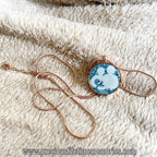 Necklace with a pendant featuring a Parent breastmilk gem meaning love never be apart singapore