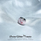 Silver charm with pink marbled design memorial cremation ashes, featuring 'Precious Lifetime Memories by Annabel' branding.
