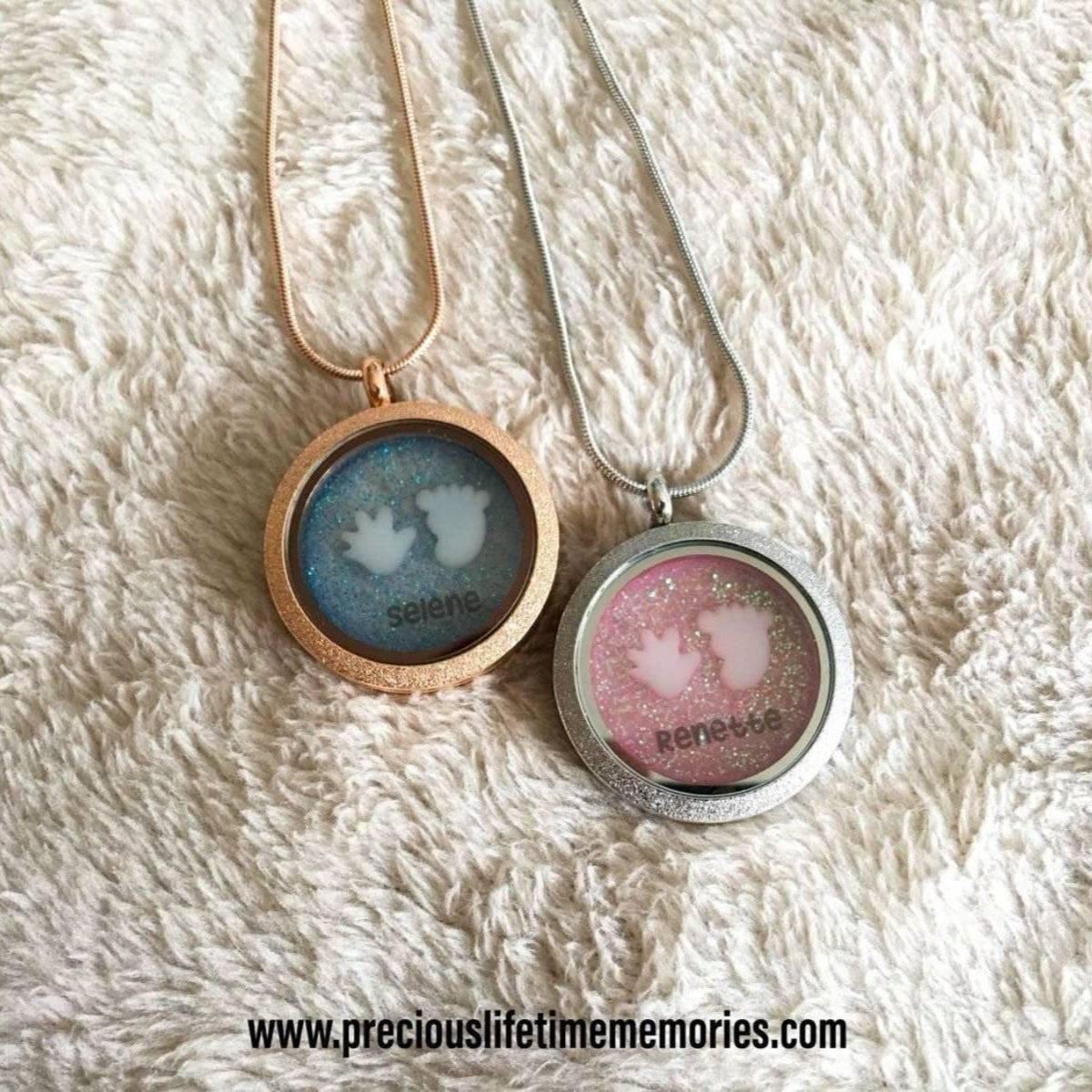 Two necklaces with round pendants on a textured white surface, featuring the brand 'precious lifetime memories'.