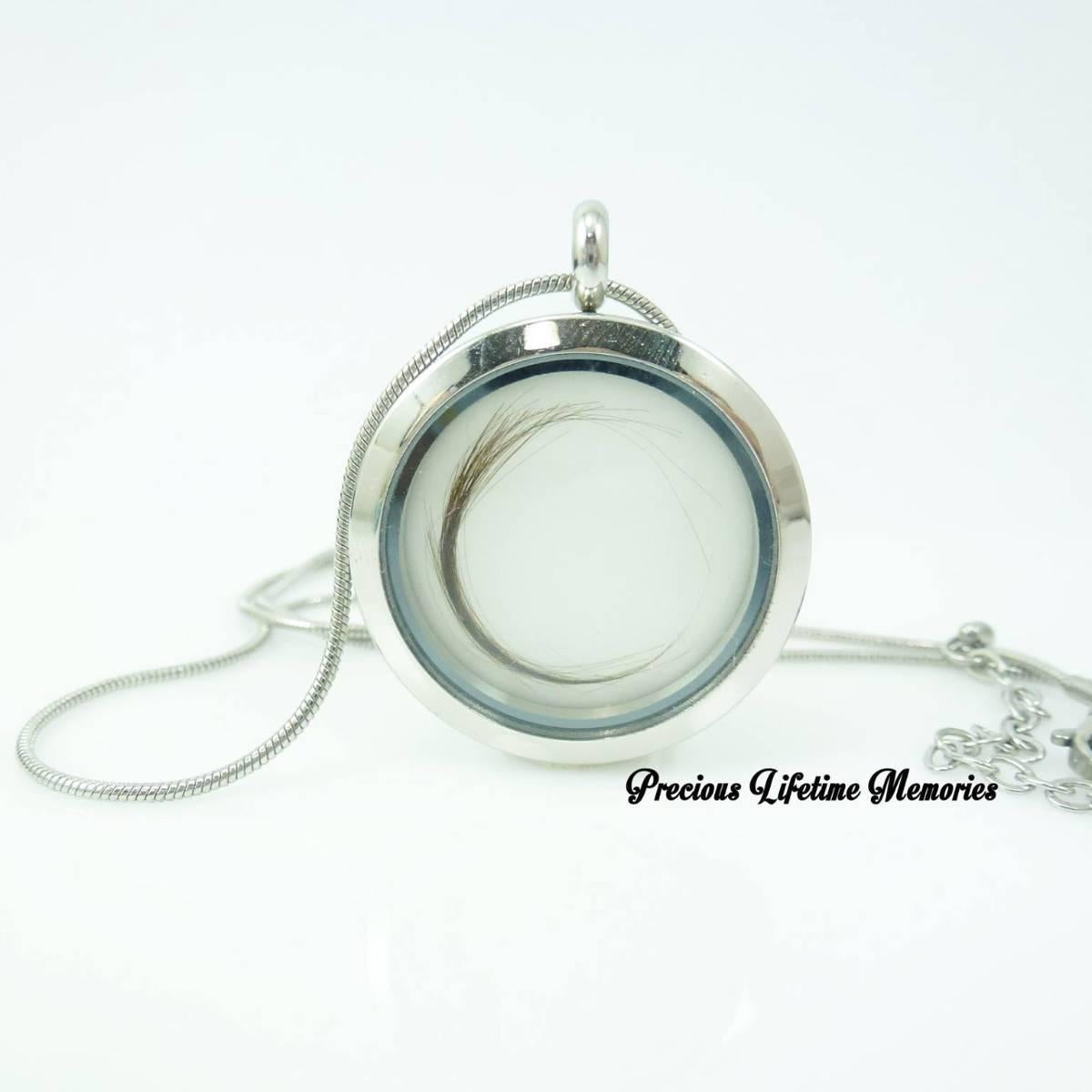 Silver locket with chain on a white background, featuring 'Precious Lifetime Memories' text.