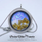 Necklace with a locket containing breastmilk and DNA, branded 'Precious Lifetime Memories by Annabel'.
