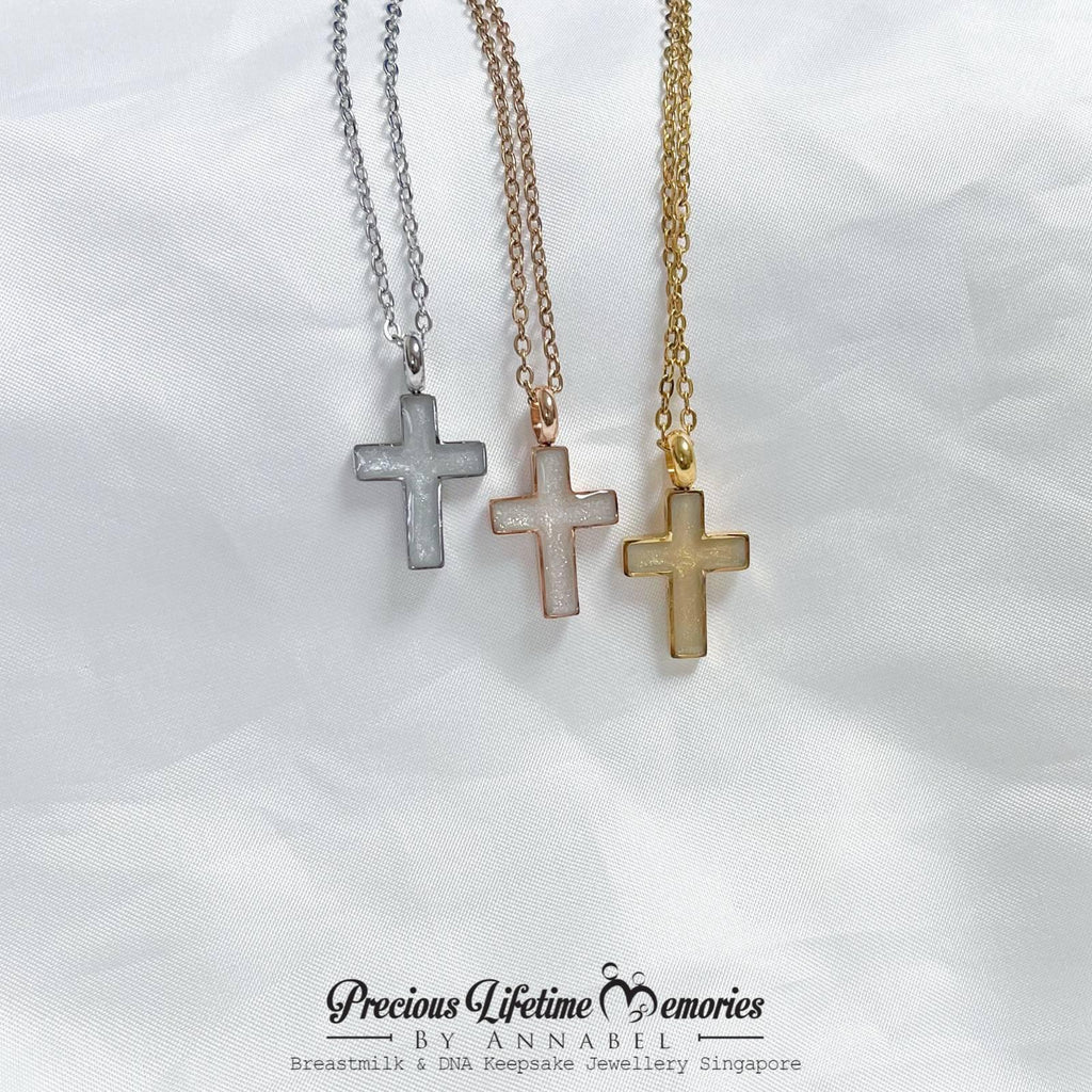 cross-shaped necklaces in silver, rose gold, and gold on a white background with 'Precious Lifetime Memories by Annabel' branding.