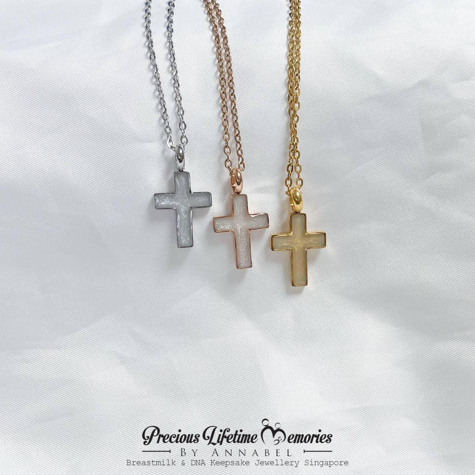 cross-shaped necklaces in silver, rose gold, and gold on a white background with 'Precious Lifetime Memories by Annabel' branding.