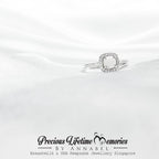 Silver ring with a diamond on a white satin background, featuring 'Precious Lifetime Memories by Annabel' branding.