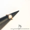 Heart-shaped ring on a black cone with 'precious lifetimes memories' branding.
