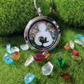 Decorative locket with colorful stones on a grassy background