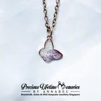 Heart-shaped with pets cremation ashes pendant on a chain with 'Precious Lifetime Memories by Annabel' branding.
