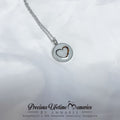 Silver necklace with a heart-shaped pendant on a white background, featuring 'Precious Lifetime Memories by Annabel'.