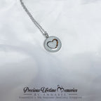 Silver necklace with a heart-shaped pendant on a white background, featuring 'Precious Lifetime Memories by Annabel'.