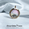 Gold locket with pink interior on a white satin background, featuring 'Precious Lifetime Memories by Annabel'.