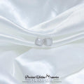 Silver earrings on a white satin background with 'Precious Lifetime Memories by Annabel' branding.