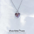 Heart-shaped necklace with a silver chain on a white background, featuring 'Precious Lifetime Memories by Annabel' branding.