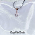 Rose gold charm on a white satin background with 'Precious Lifetime Memories by Annabel' branding.