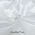 Silver breastmilk Oval ring on a white satin background with 'Precious Lifetime Memories by Annabel' branding.